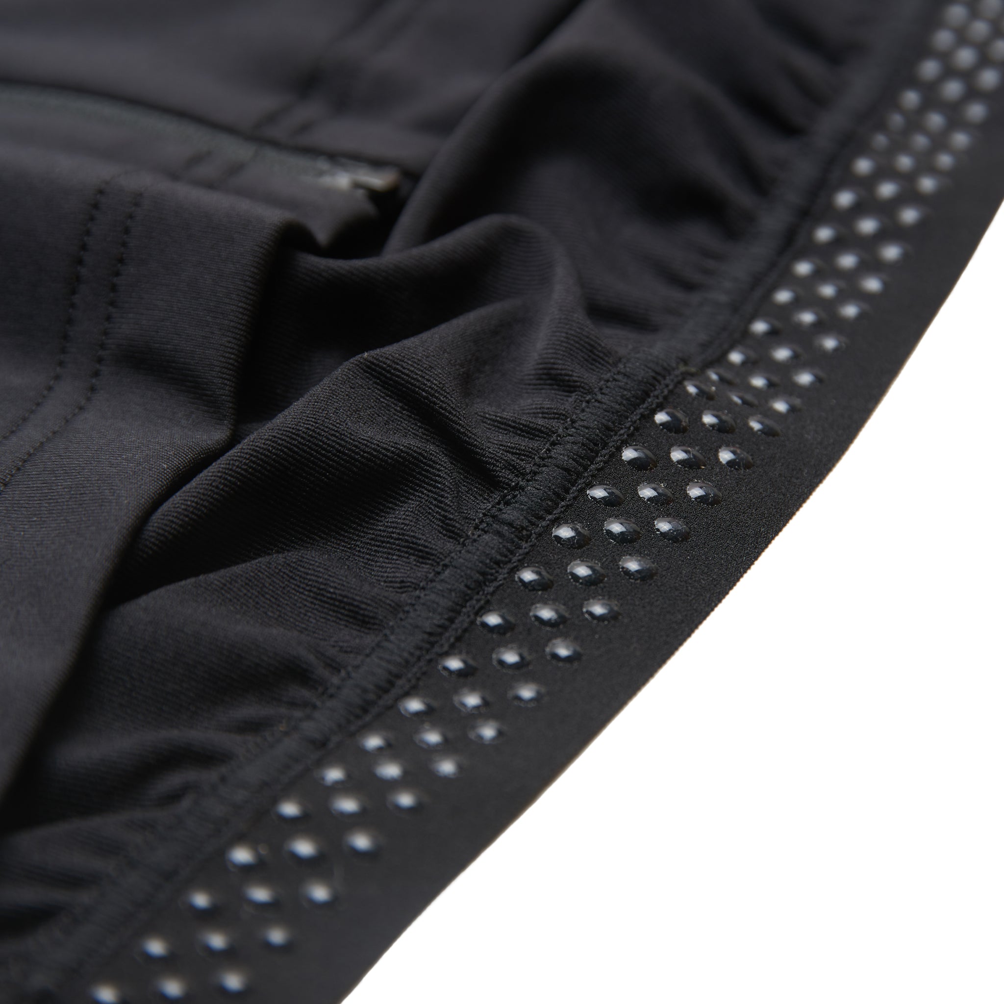 "The Fe226 Black Cycling Jersey features an aerodynamic race fit for a comfortable feel, equipped with three back pockets, a zipped security pocket, and reflective logo prints for enhanced visibility in low-light conditions. This high-quality, odorless summer cycling jersey is perfect for road cycling, gravel riding, mountain biking, triathlon training, commuting, and racing."